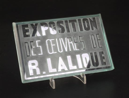 An inter-war period Exposition Des Oeuvres De R. Lalique exhibition plaque, introduced in 1928, 10 x 15cm.
